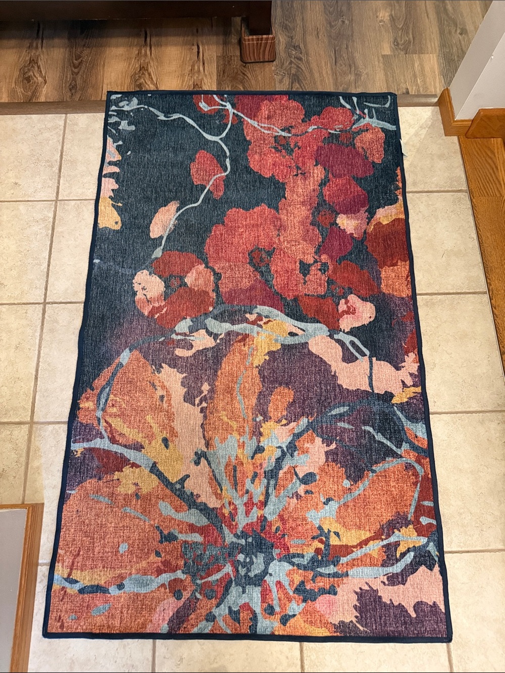 Ruggable flat woven watercolor floral rug in Navy and Coral. Cover only
